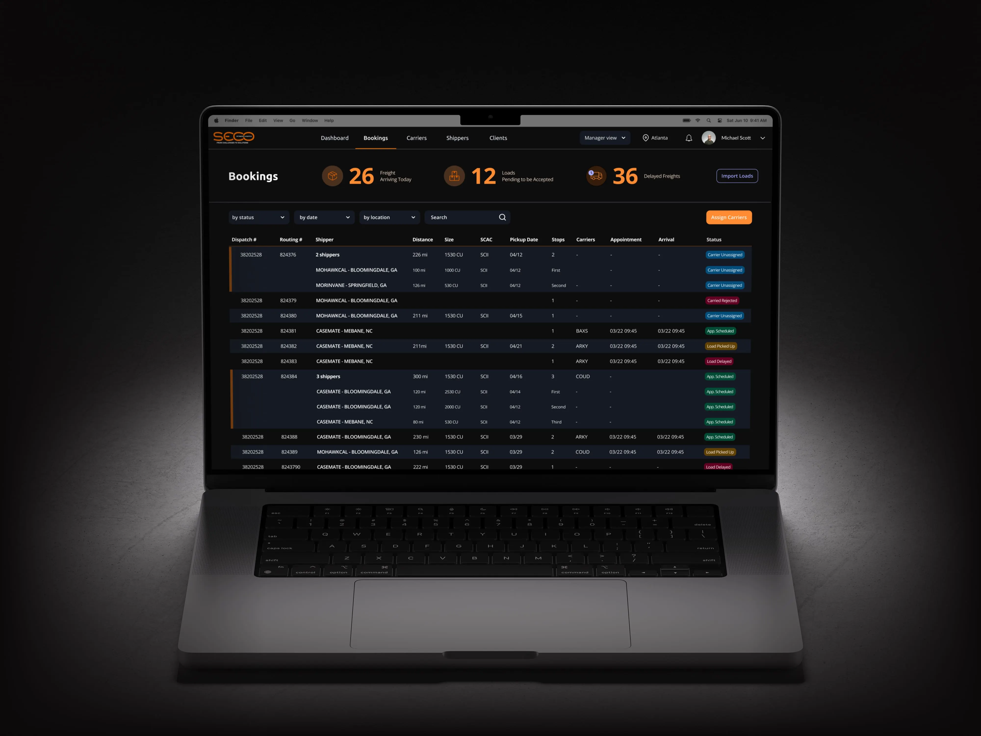 Laptop on a dark surface, showing the Seco bookings dashboard